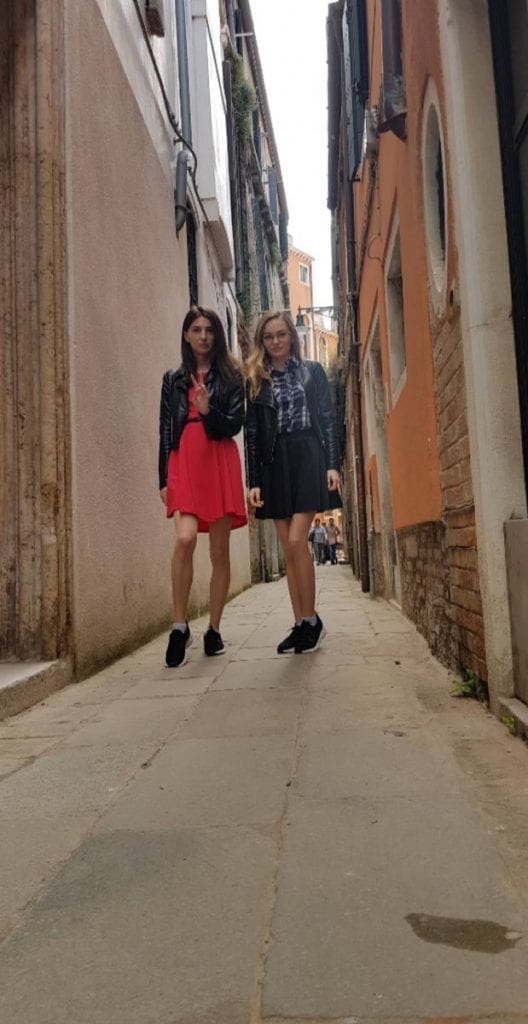Mila and Vica walking in a street